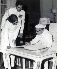 Shri Fakhruddin Ali Ahmed signing the Oath Register after assuming office of the President