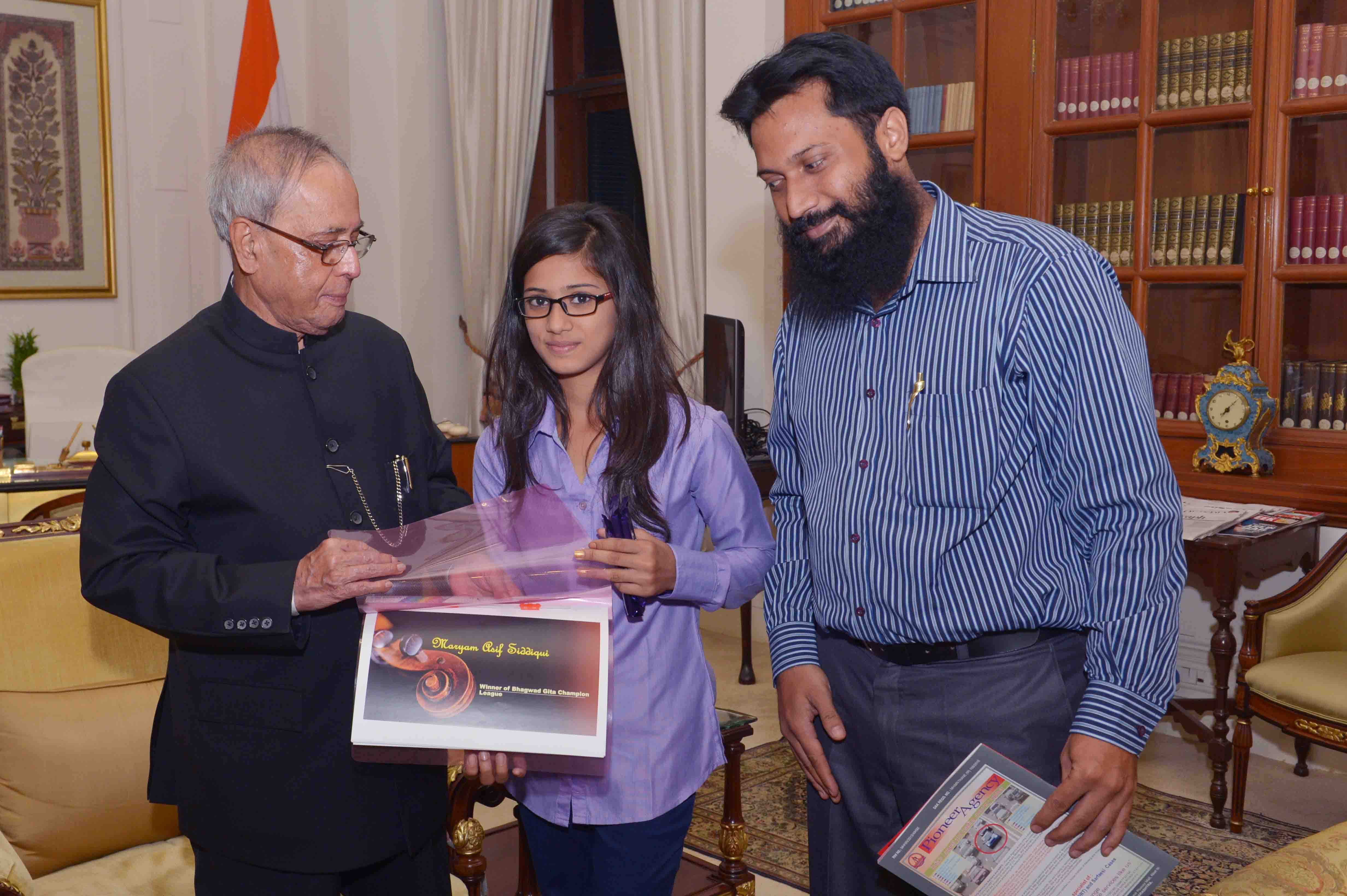 The President of India, Shri Pranab Mukherjee meeting with Ms. Maryam Asif Siddiqui, aged 12 who won a Bhagavad Gita Competition organized by ISKCON along with her parents from Thane, Maharashtra at Rashtrapati Bhavan on May 22, 2015.