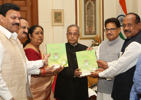 The Chairman of the National Commission for Scheduled Castes, Dr. P.L. Punia along with other members presenting the Annual Report for the Period from June 2010 to March 2012 to the President of India, Shri Pranab Mukherjee at Rashtrapati Bhavan in New De