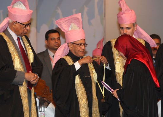 The President of India, Shri Pranab Mukherjee presenting a degree to a graduating student at the 18th Convocation of the University of Kashmir at Srinagar in Jammu and Kashmir on September 27, 2012. Also seen are the Governor of Jammu and Kashmir, Shri N.