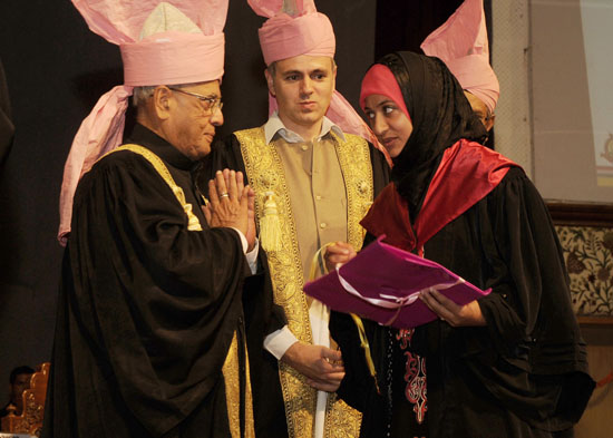 The President of India, Shri Pranab Mukherjee presenting a degree to a graduating student at the 18th Convocation of the University of Kashmir at Srinagar in Jammu and Kashmir on September 27, 2012. Also seen is the chief Minister of Jammu and Kashmir, Sh