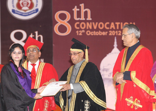 The President of India, Shri Pranab Mukherjee presenting a degree to a graduating student at the 8th Convocation Ceremony of King George's Medical University at Lucknow in Uttar Pradesh on October 12, 2012.