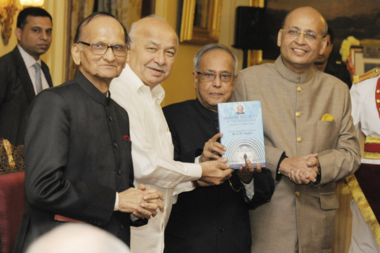 The President of India, Shri Pranab Mukherjee receiving a book of 'Human Society at the Crossroads' on Dr. L.M. Singhvi at Rashtrapati Bhavan in New Delhi on November 9, 2012. Also seen are the the Union Minister of Home Affairs, Shri Sushilkumar Shinde