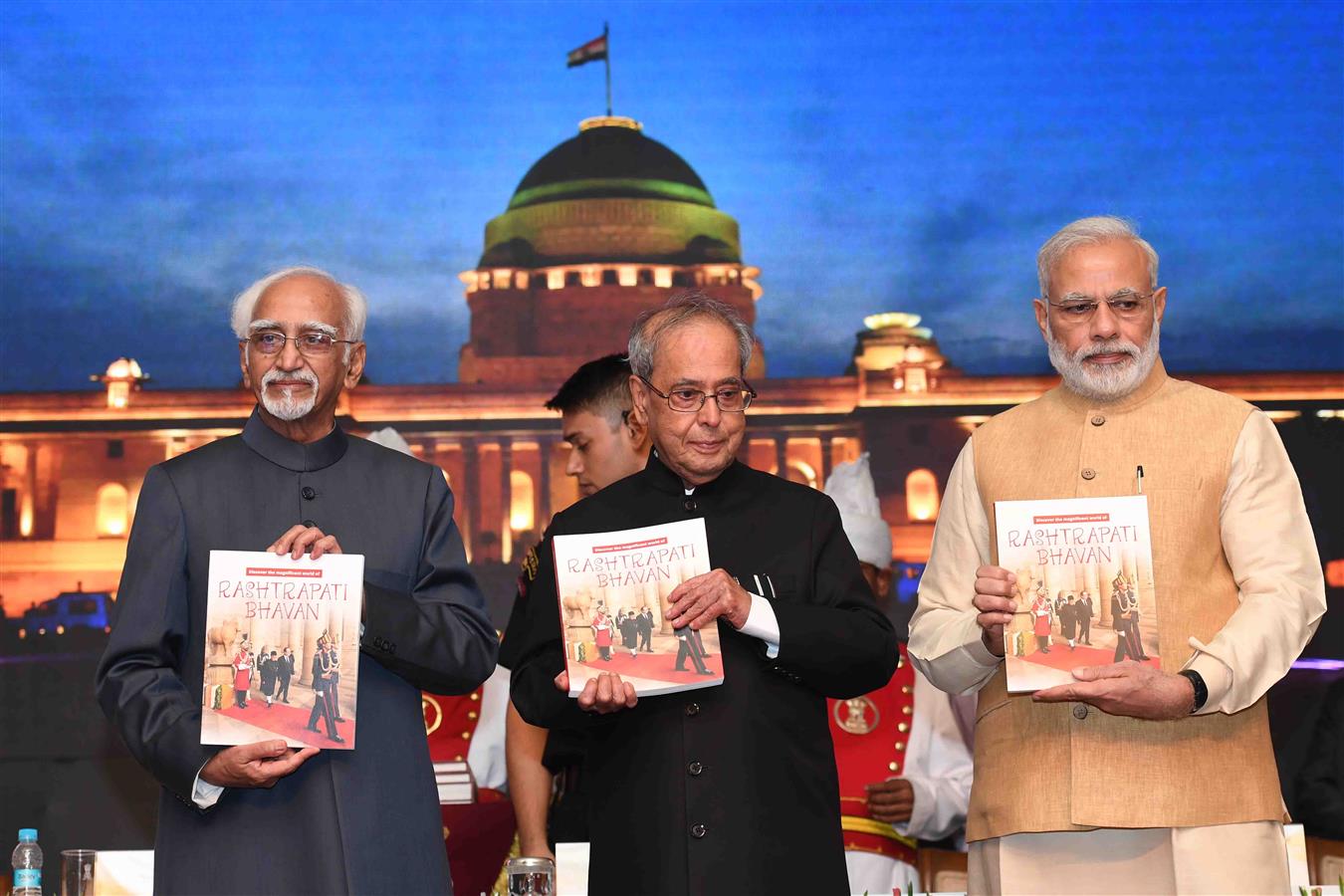 The Vice President of India, Shri M. Hamid Ansari releasing the book titled "Discover the Magnificent World of Rashtrapati Bhavan" and first copy presented to the President of India, Shri Pranab Mukherjee at Rashtrapati Bhavan on July 25, 2016. 